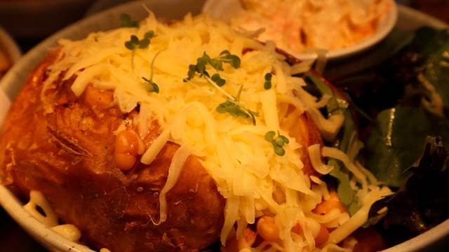 Jacket potato with cheese, beans, coleslaw and dressed salad
